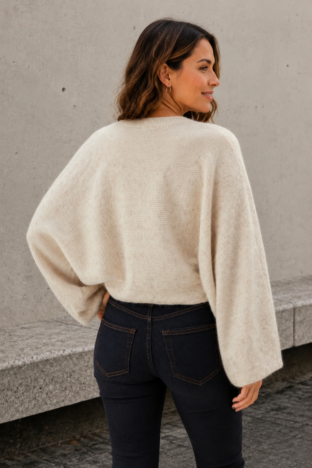 White knitted bolero back view with relaxed cropped fit