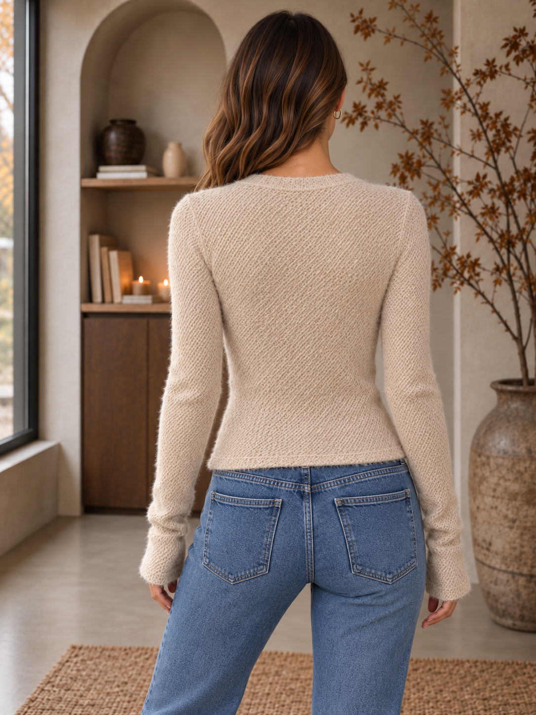 Women's beige textured long sleeve top back view