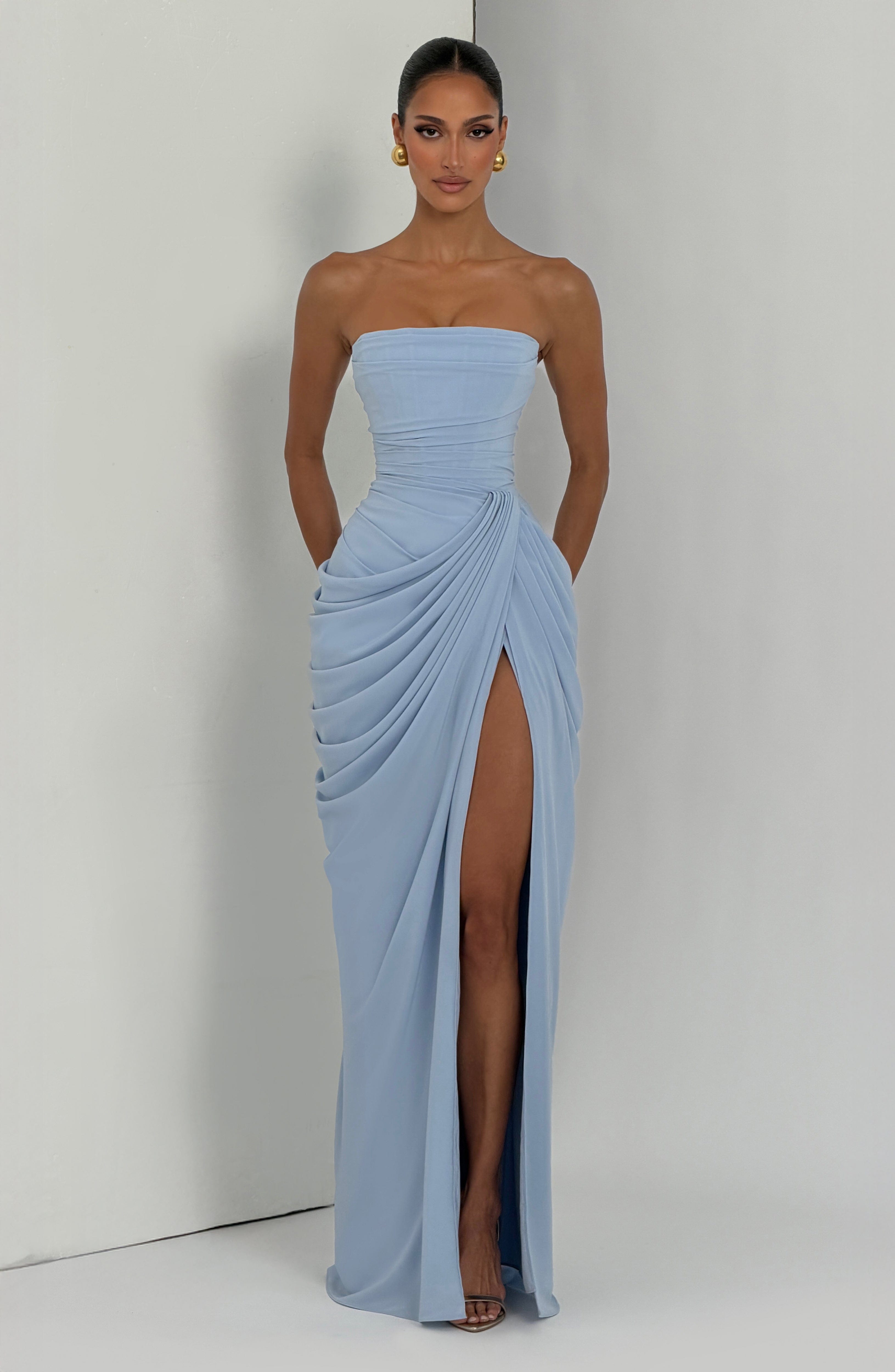 Women's maxi dress with strapless neckline, gathered draping, and high side slit detail