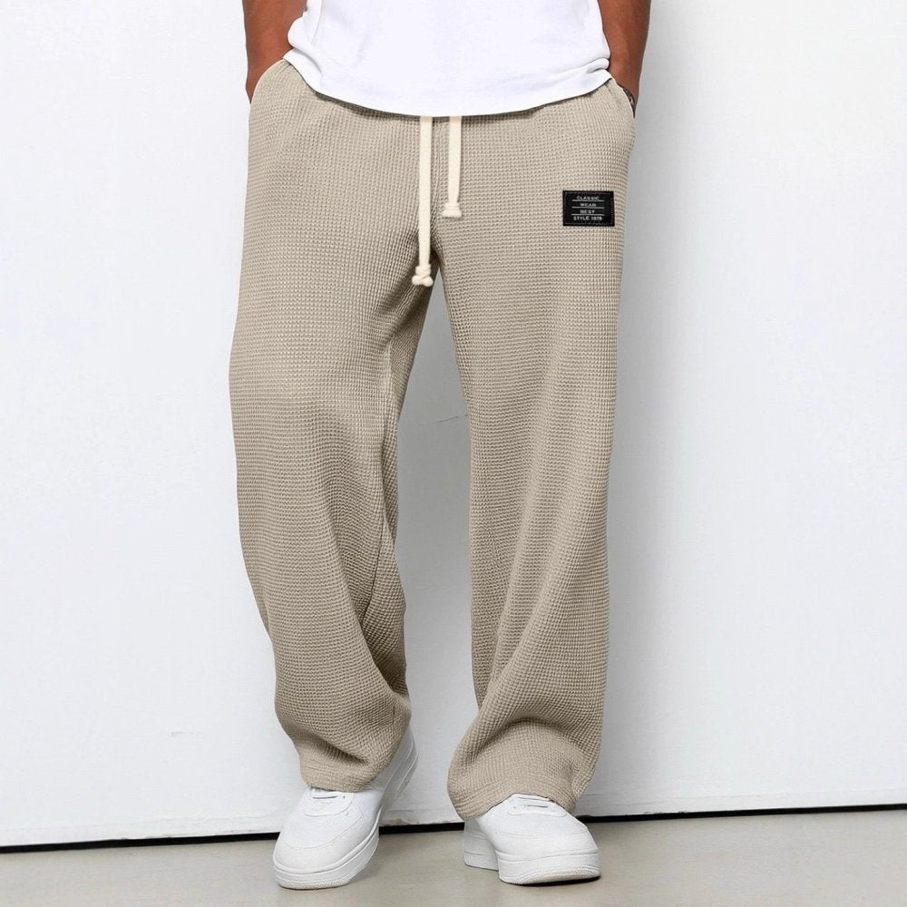 Full-length men's waffle-knit pants with elastic waistband and relaxed silhouette