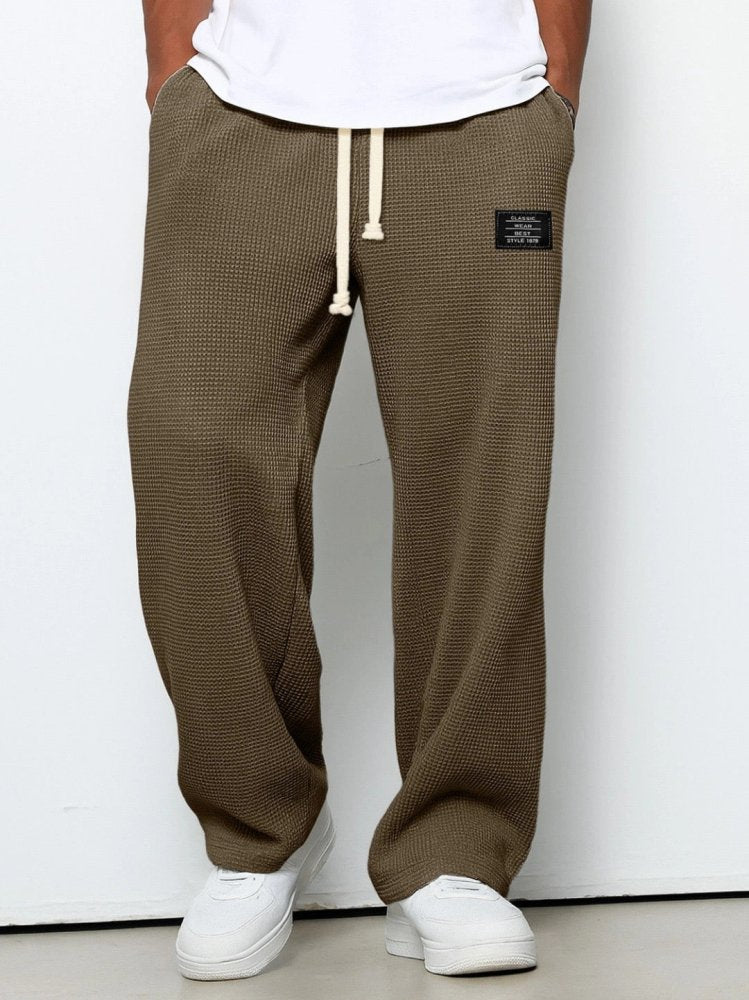 Men's waffle-knit relaxed trousers with elastic drawstring waist and straight silhouette