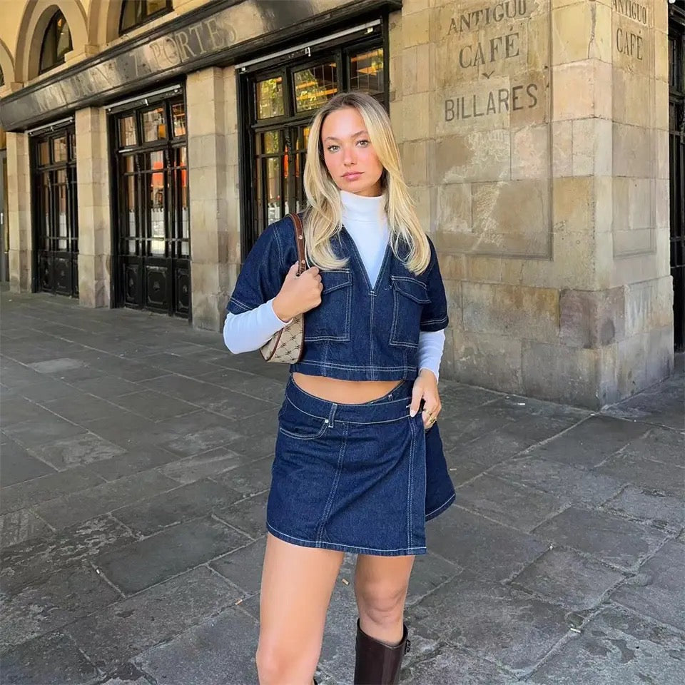 Women's denim co-ord set featuring a structured cropped top and wrap-front mini skirt