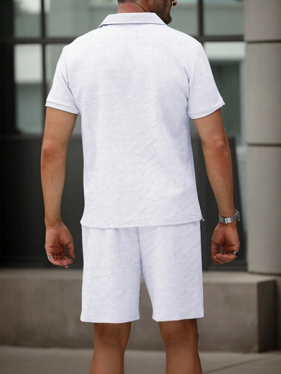 Textured men's polo set with short sleeves and coordinating shorts featuring an elasticated waist