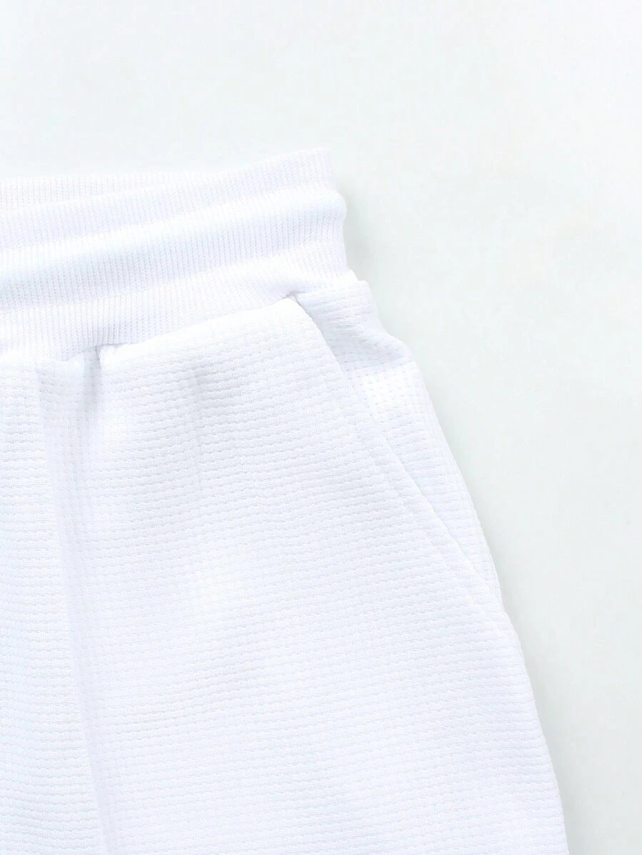 Relaxed-fit men's polo and shorts set with drawstring waist and matching textured construction