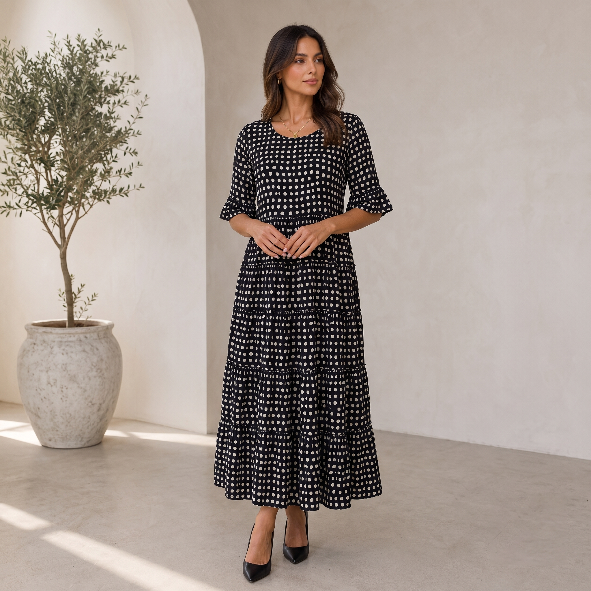 Women's relaxed-fit polka dot midi dress with ruffled skirt and elbow-length sleeves