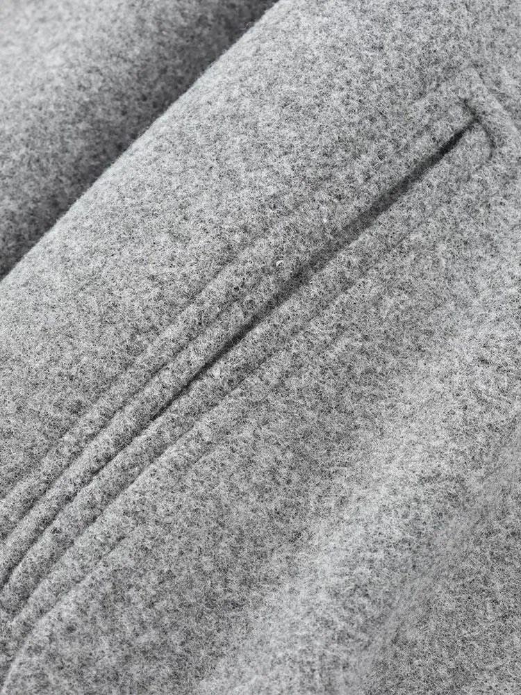 Relaxed-fit women's jacket with textured fabric and elastic cuffs