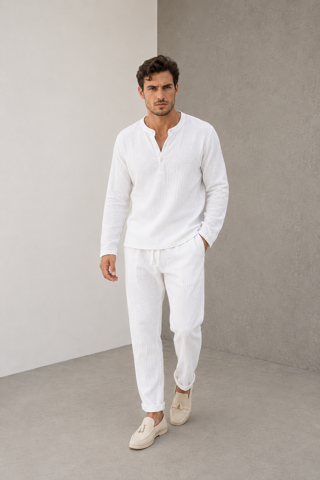 Men's white two-piece textured lounge set with long-sleeved Henley shirt and trousers