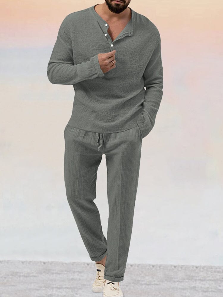 Men's casual two-piece lounge set with Henley neckline shirt and coordinating drawstring trousers, three-quarter view