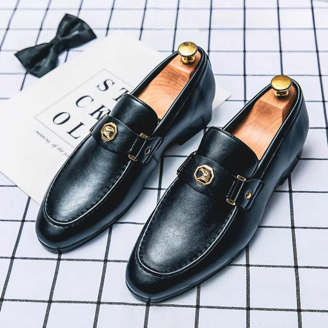 Men's leather loafers with low heel, round toe, and strap across the upper