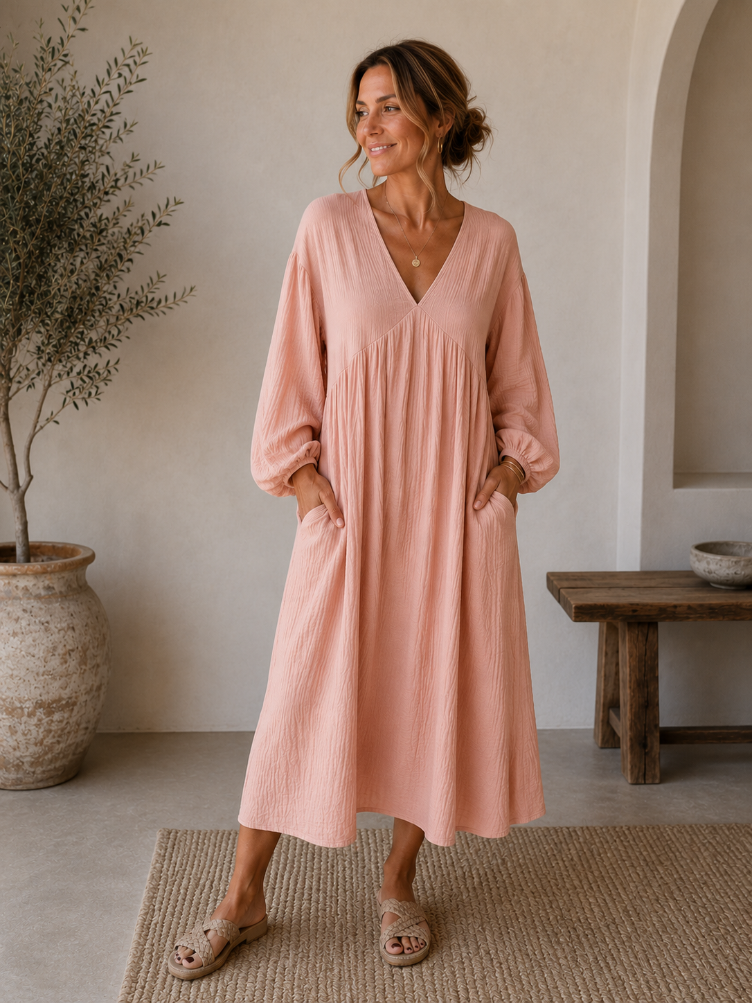 Women's midi-length dress with V-neckline, gathered front, and elastic cuffs in a relaxed, flowing fit