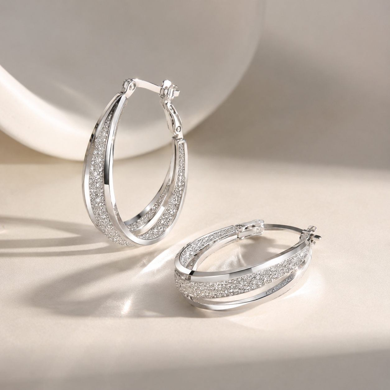 Textured metal hoop earrings with engraved detail and hinge clasp