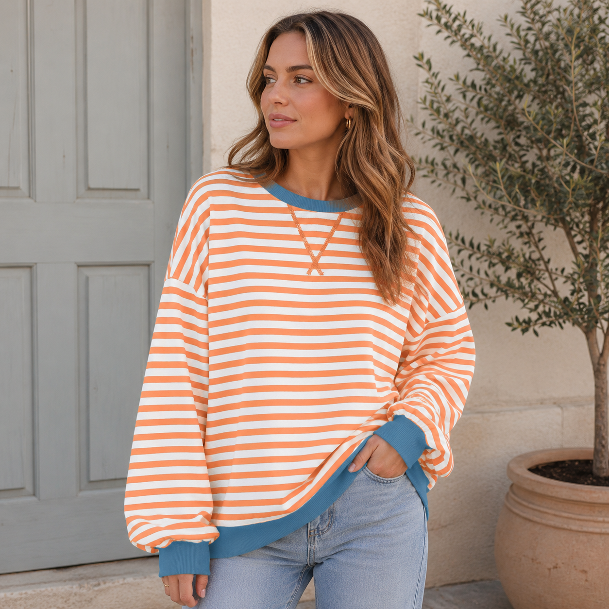 Women's striped sweatshirt with contrast-colored hem and cuffs, oversized fit and round neckline