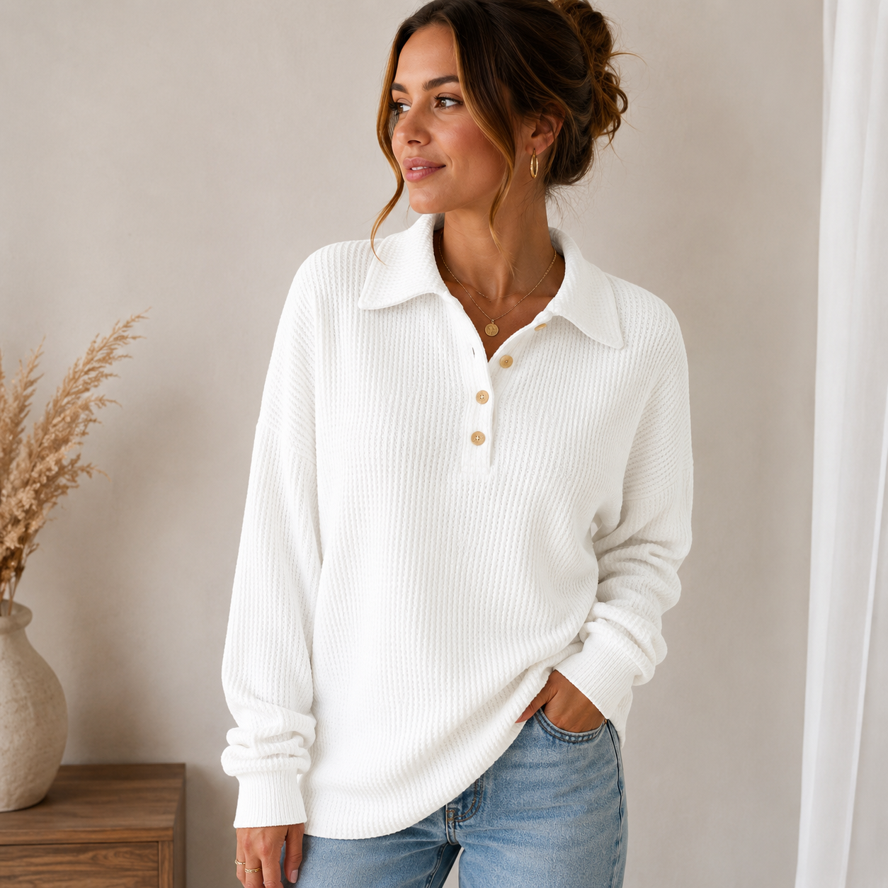 Relaxed-fit women's waffle-knit sweater with ribbed cuffs and collar