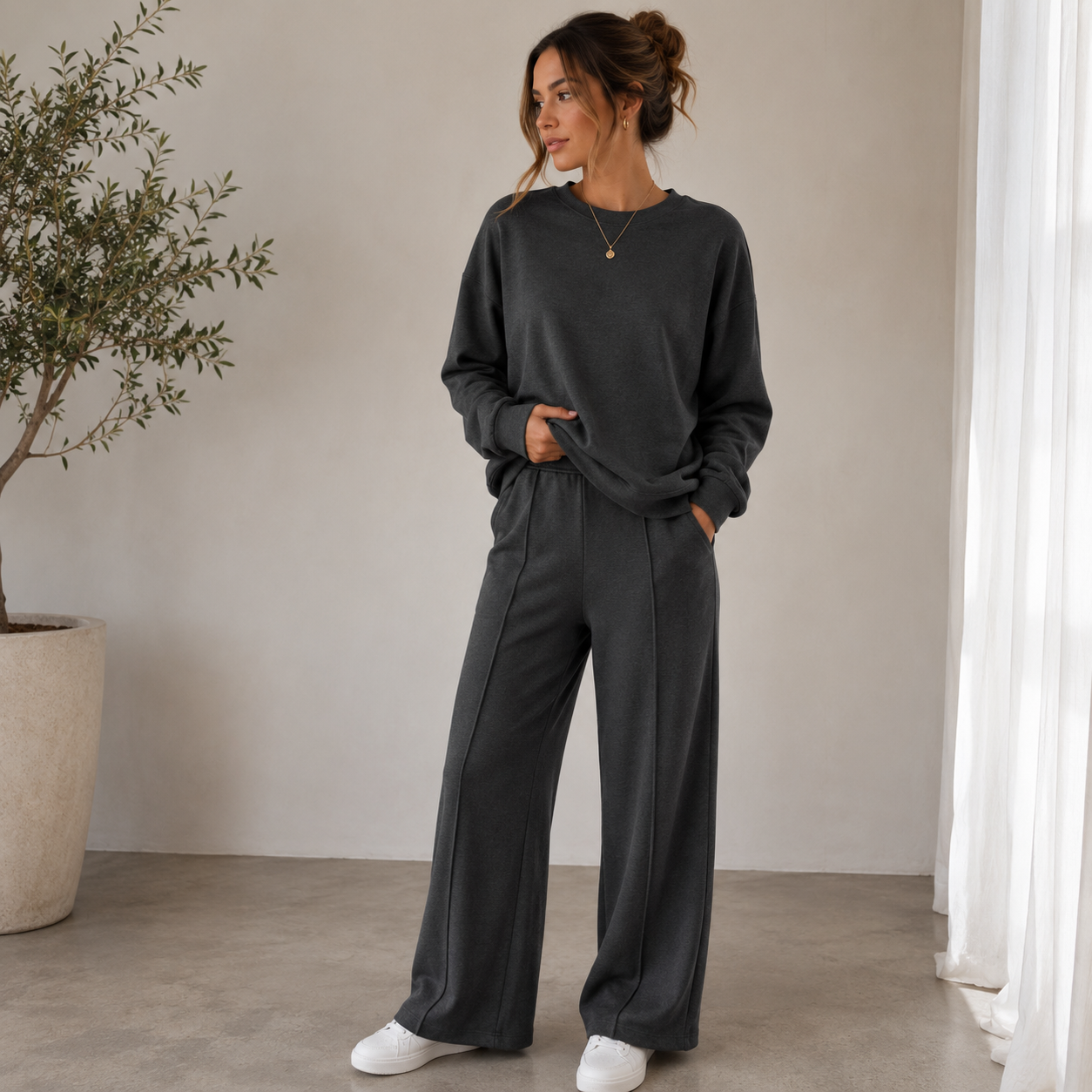 Women's relaxed-fit two-piece set featuring a long-sleeve top and full-length wide-leg trousers in polyester