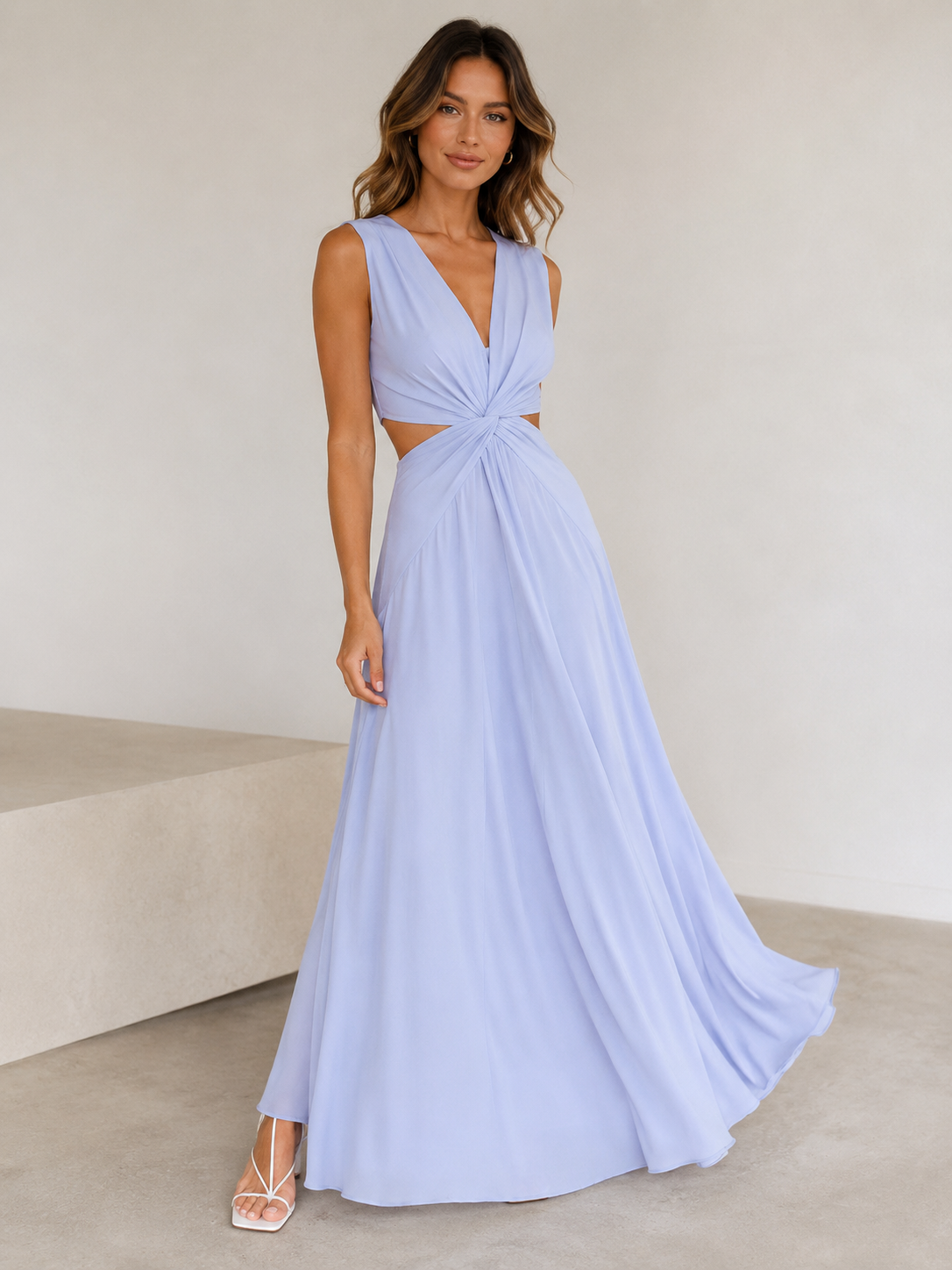 Women's maxi dress with defined silhouette, sleeveless cut, and subtle side cut-out