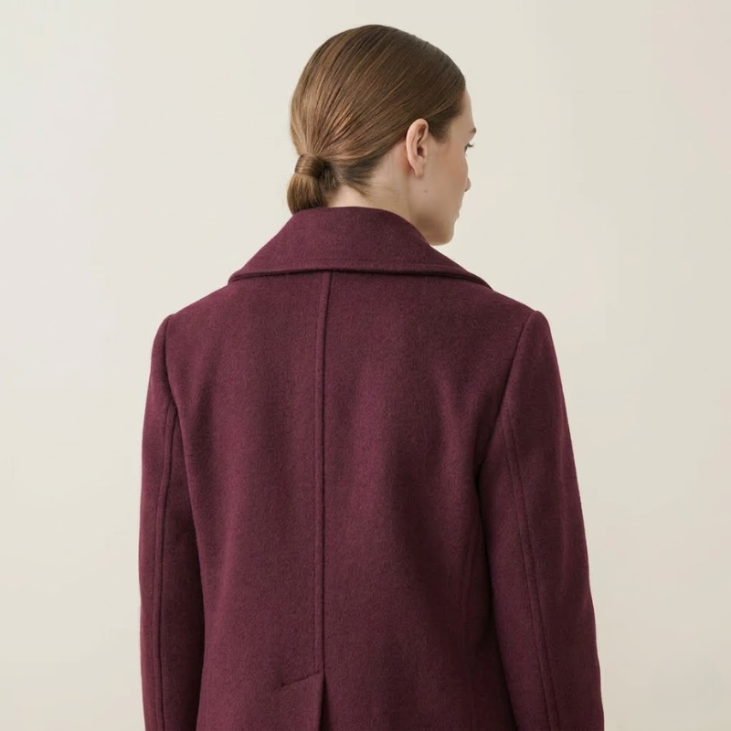 Double-breasted women's short coat with wide lapel collar and clean seam detailing