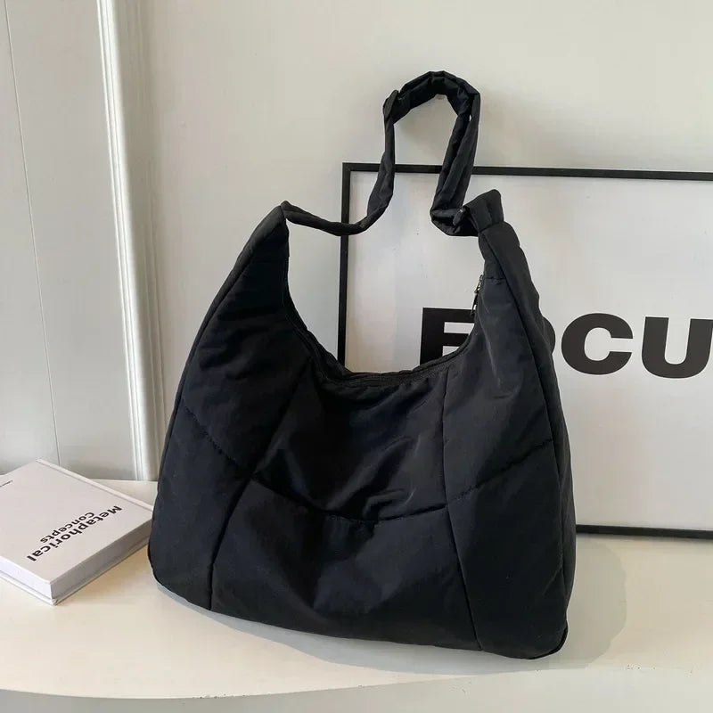 Padded shoulder bag showing overall size and silhouette
