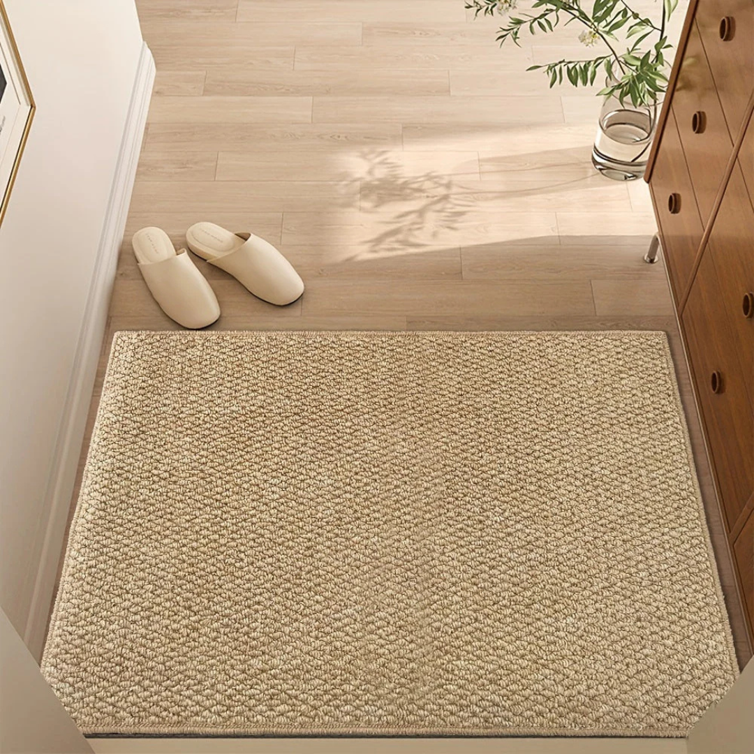 Woven entrance mat with dense flat-weave surface and reinforced edges for indoor use