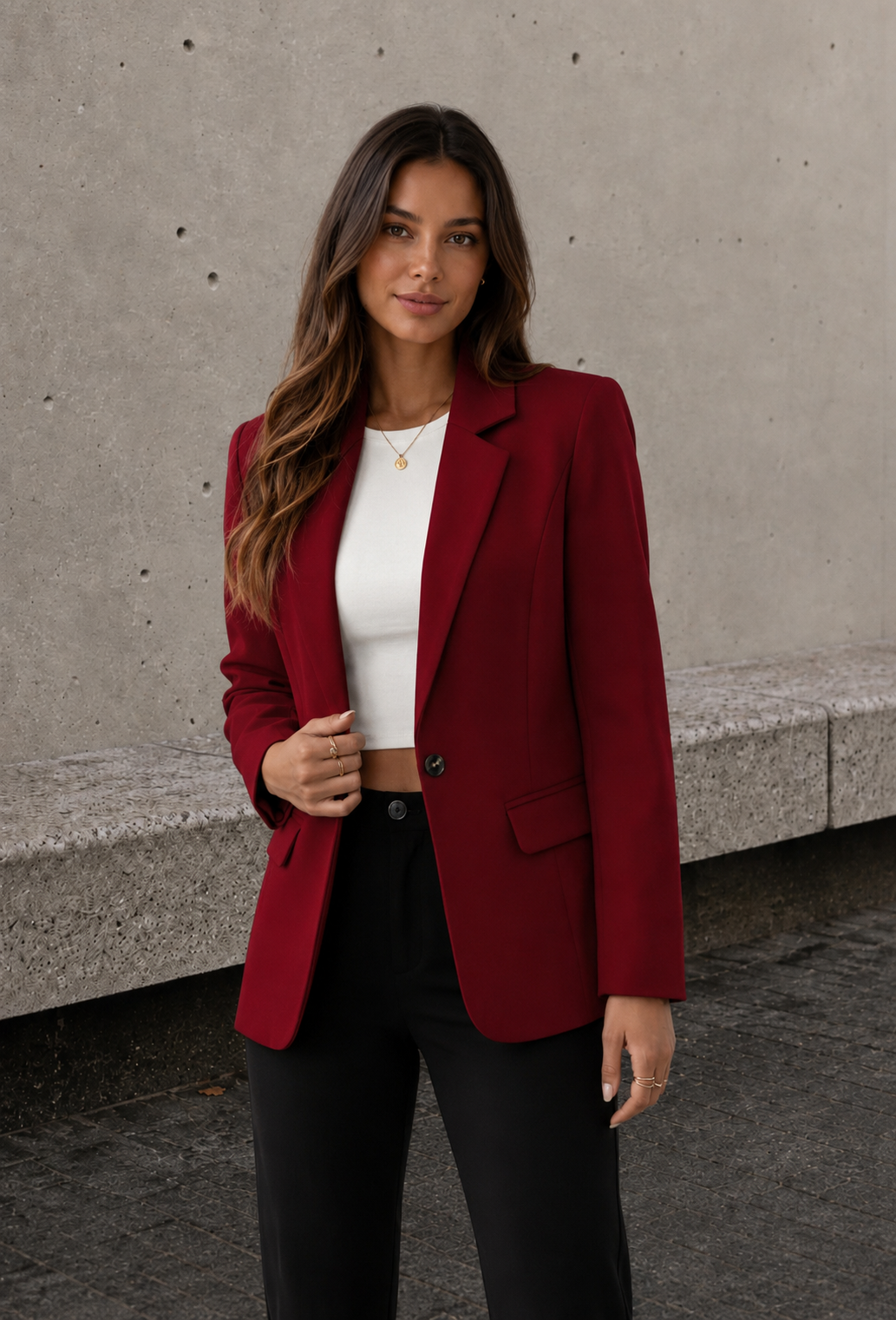 Wine red women's blazer styled with black trousers