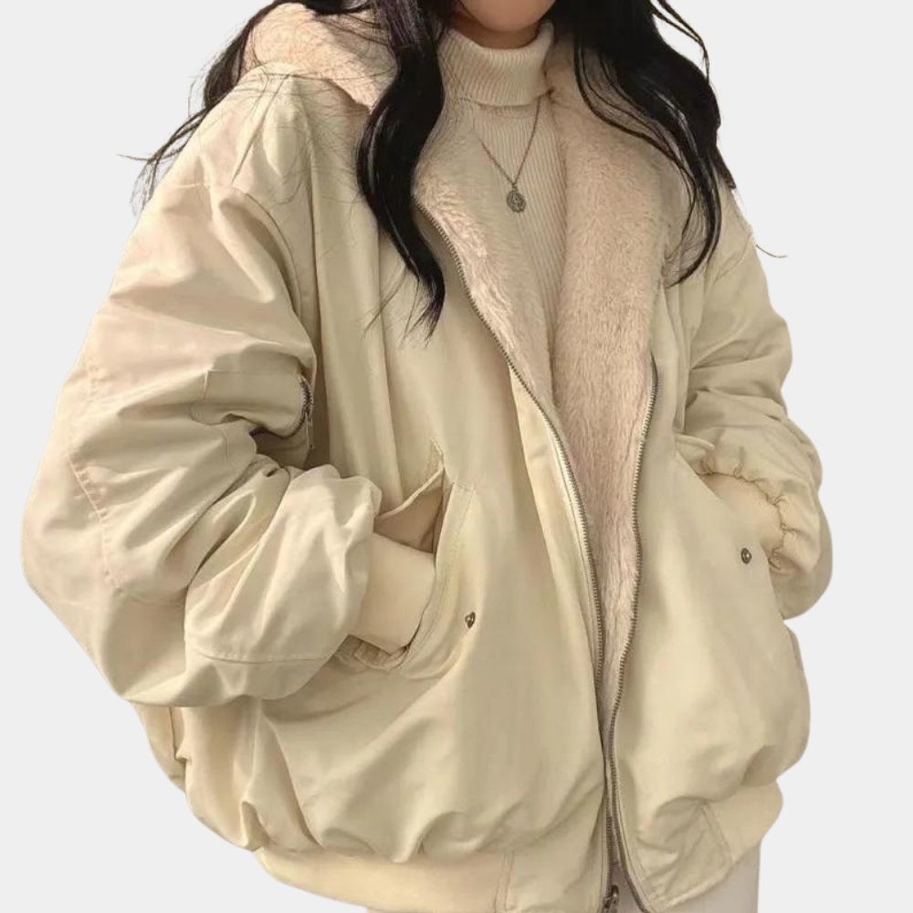 Close-up of high collar and faux fur lining on women's oversized winter jacket