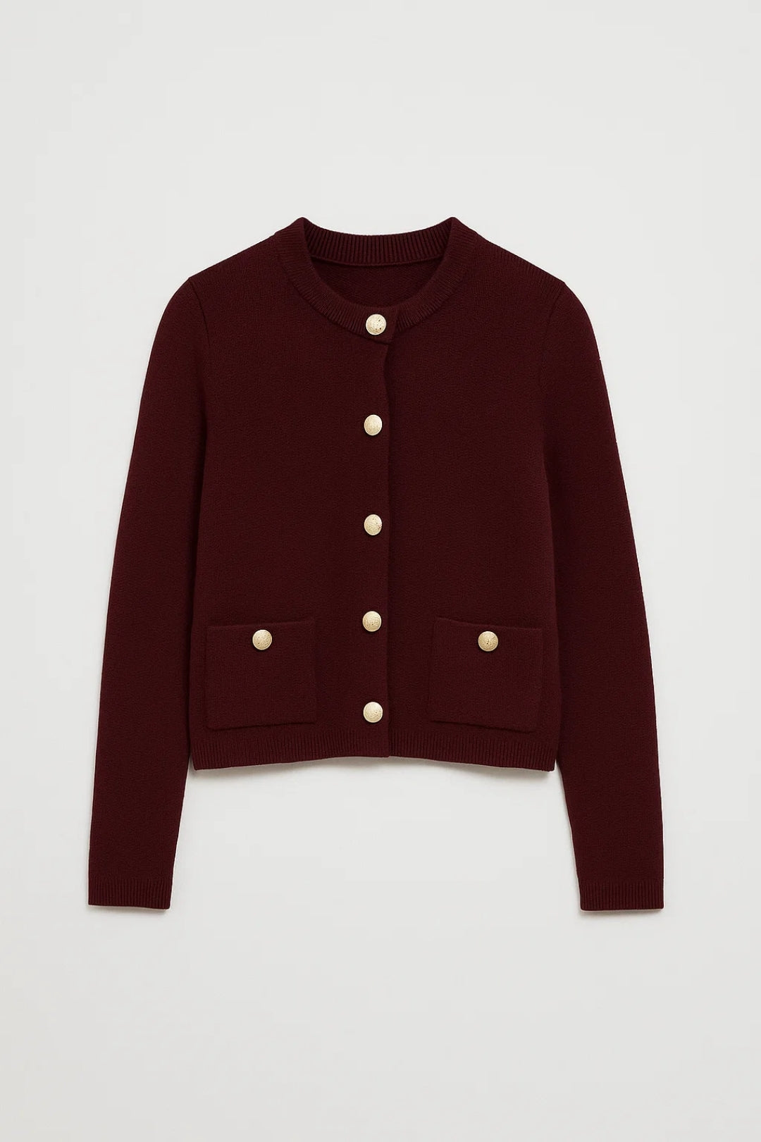 Långärmad kofta i stickad struktur med framfickor och knappdetaljer för kvinnor