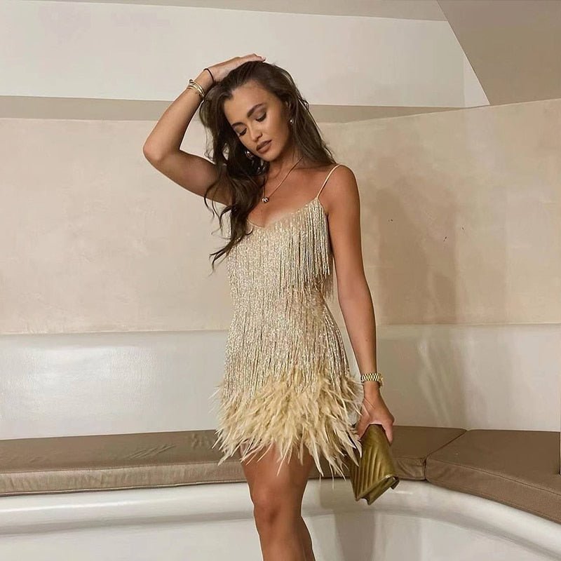 Women's fringe mini dress with feather trim in a warm metallic tone, fitted mini length