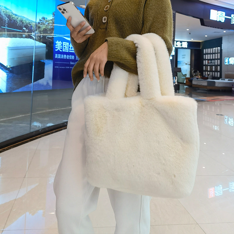 Women's faux fur tote bag side profile showing bag depth and silhouette