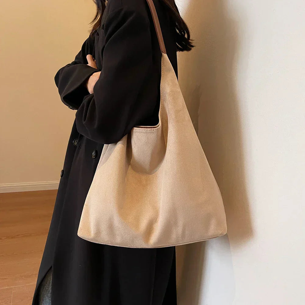 Minimalist shoulder tote bag with smooth exterior and relaxed shape