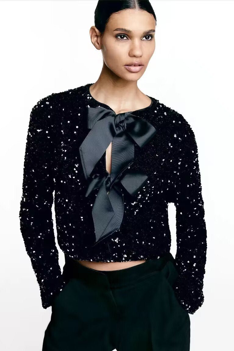 Women's short jacket with decorative bow, three-quarter angle view