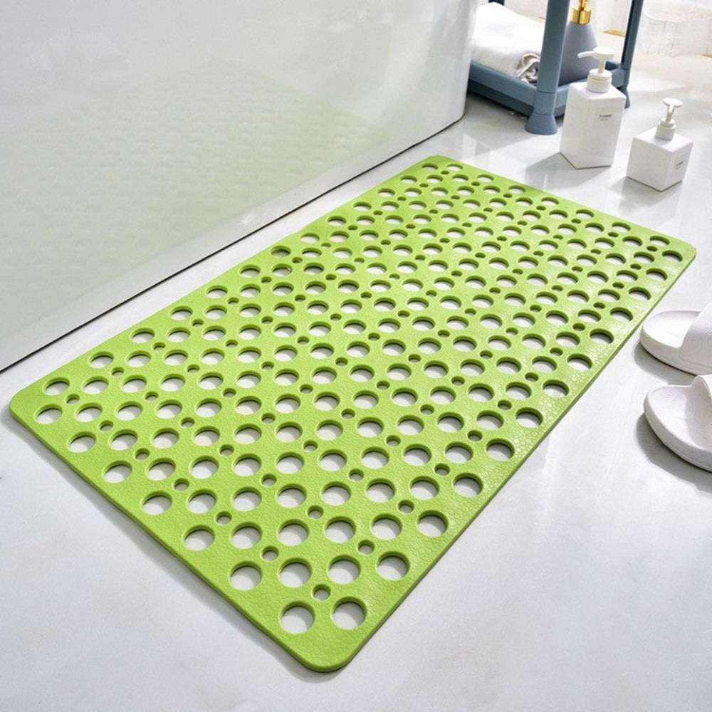 Rubber bathroom floor mat with perforated surface for water drainage and grip