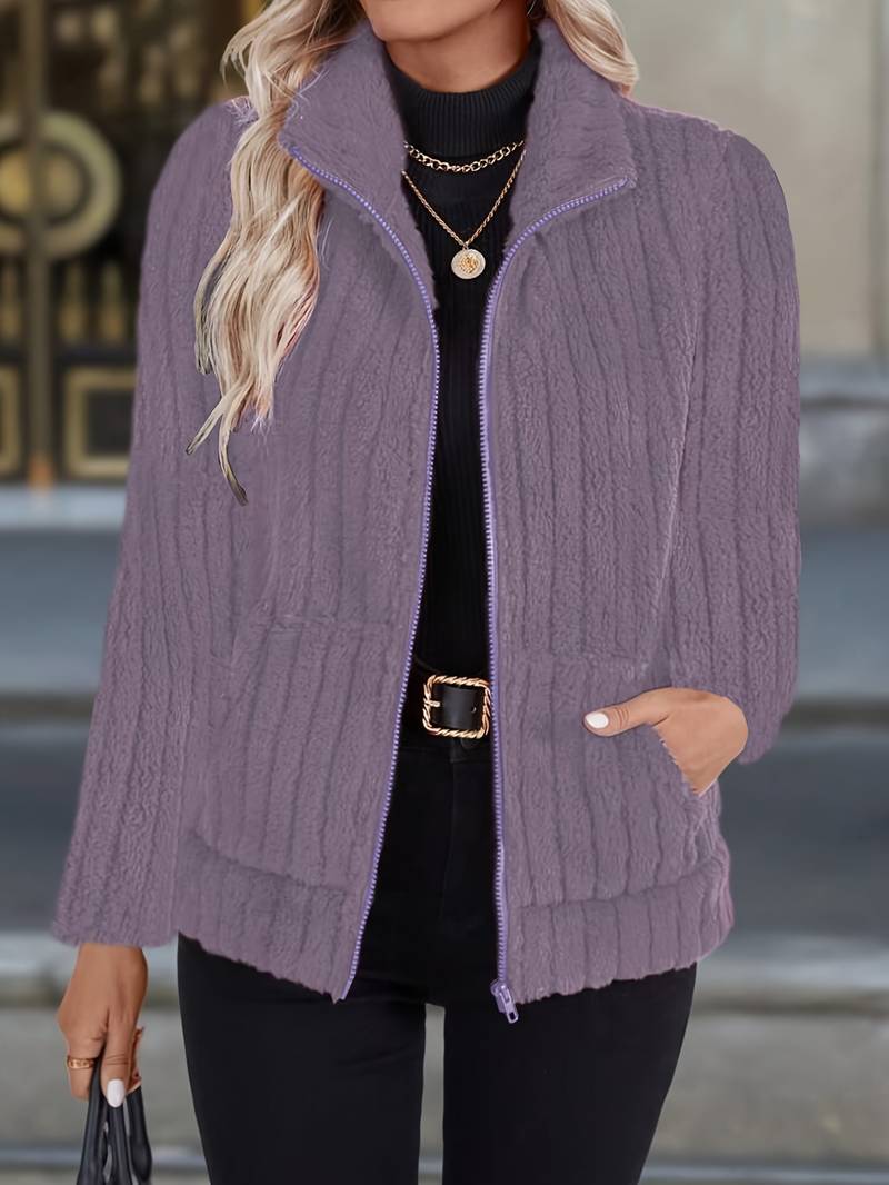 Women's zip-up jacket featuring a high collar, structured polyester blend material, and a clean everyday silhouette