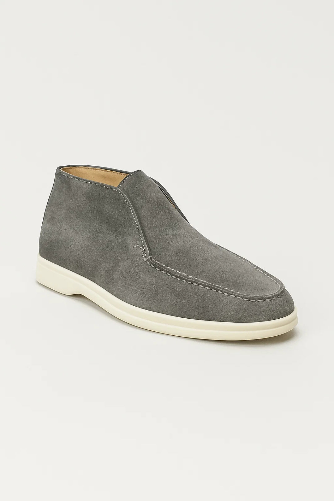 Men's slip-on suede chukka boots with a rounded toe, visible seam detailing, and a flat rubber sole