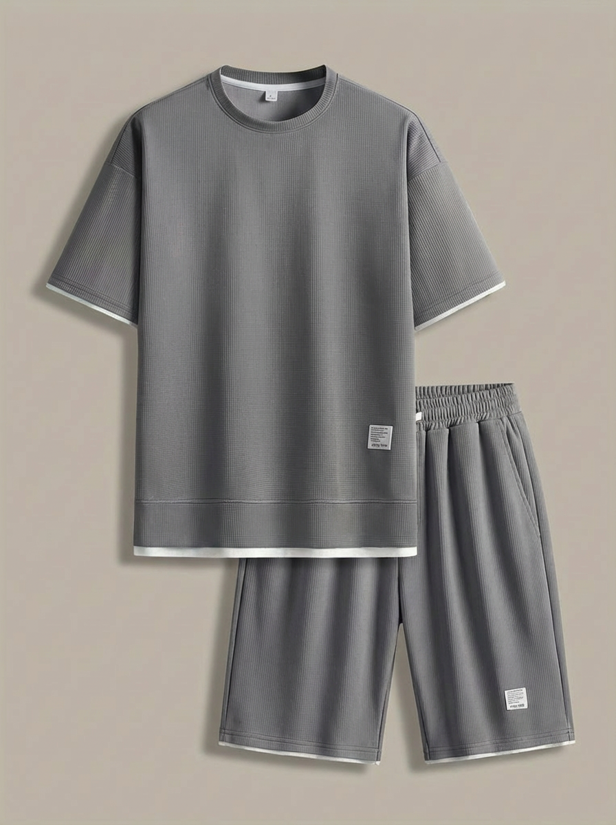 Two-piece men's set with short sleeves and elastic waistband shorts in lightweight structured fabric