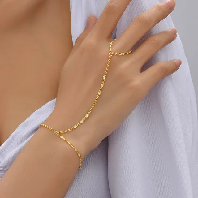 Hand chain bracelet with ring detail for women, delicate linked chain connecting wrist to finger
