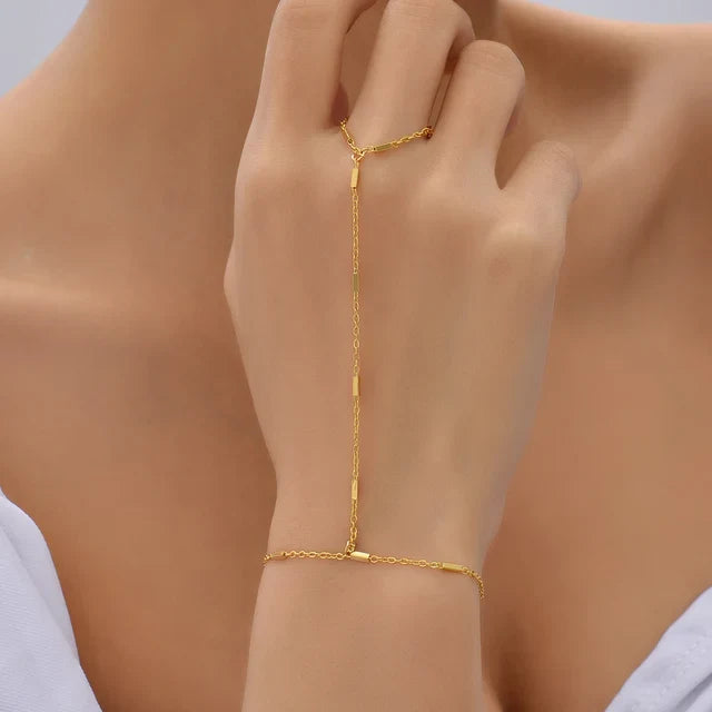 Women's adjustable hand chain bracelet with ring, smooth metal finish and lightweight chain construction