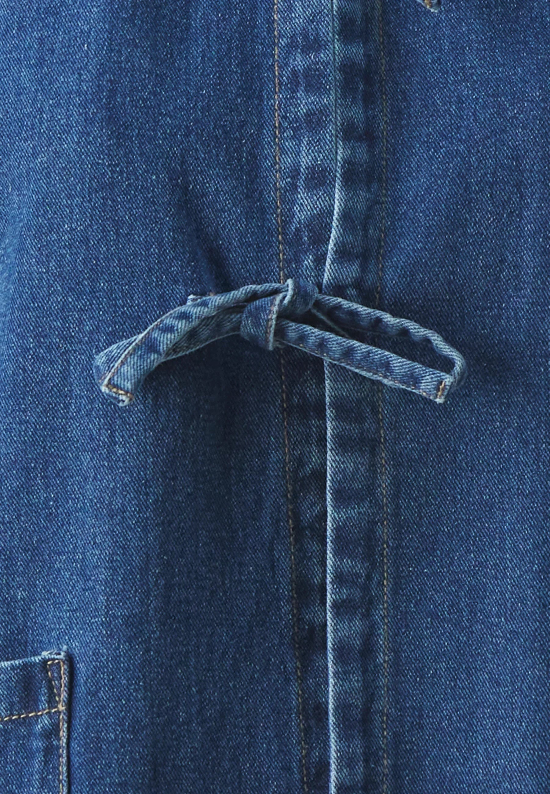 Denim jacket with front tie-detail, long sleeves, and patch pockets for women