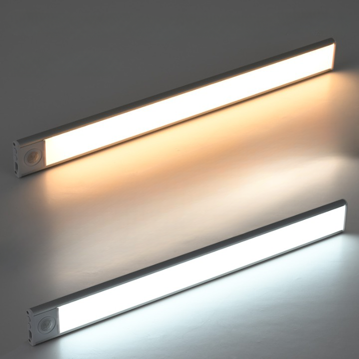 Compact rechargeable LED lamp with magnetic strip mounting for wardrobes and cabinets