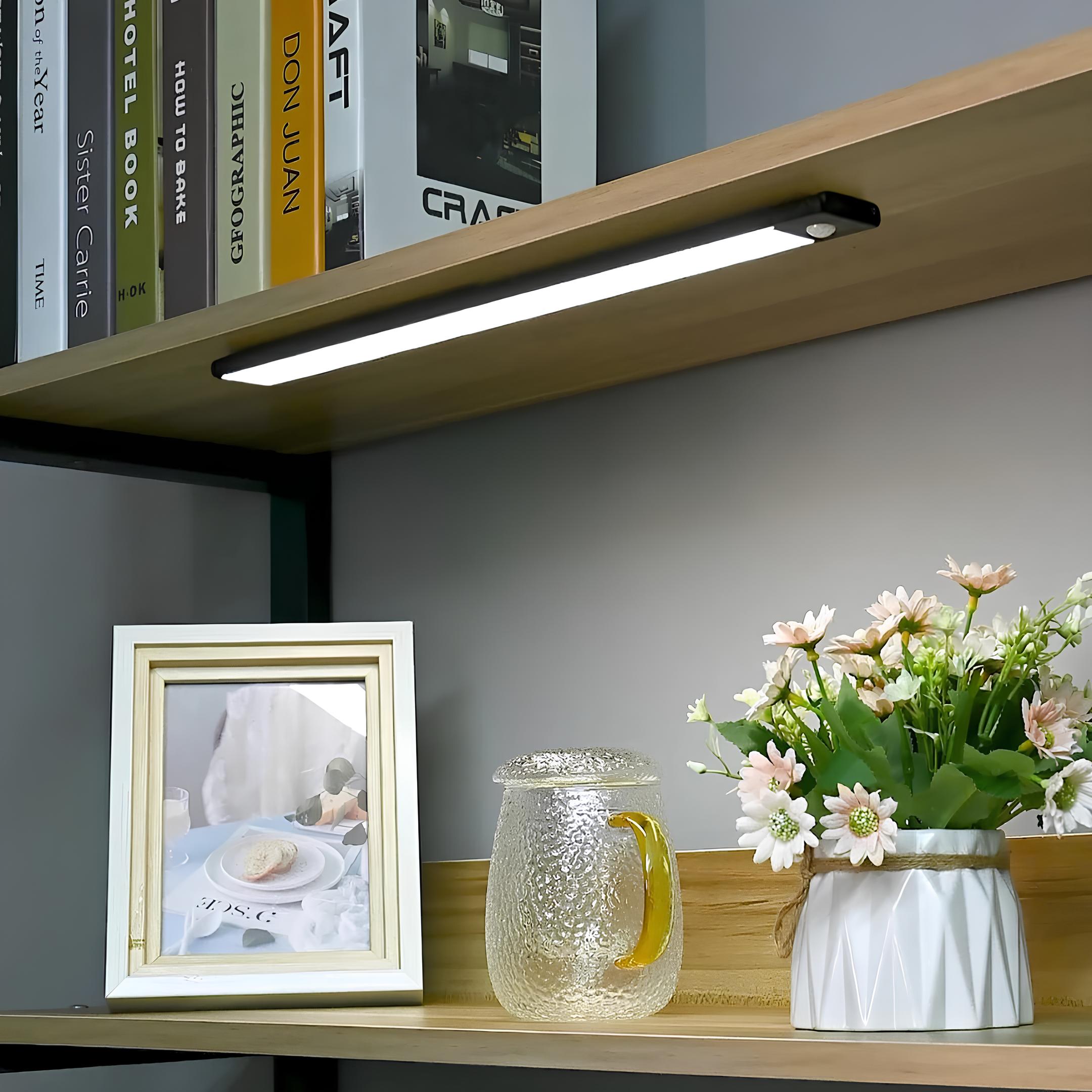 Close-up of rechargeable LED lamp with motion sensor showing USB charging port