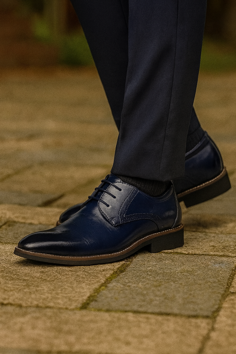 Pair of men's leather Oxford shoes top-down view showing lace-up detail and toe cap