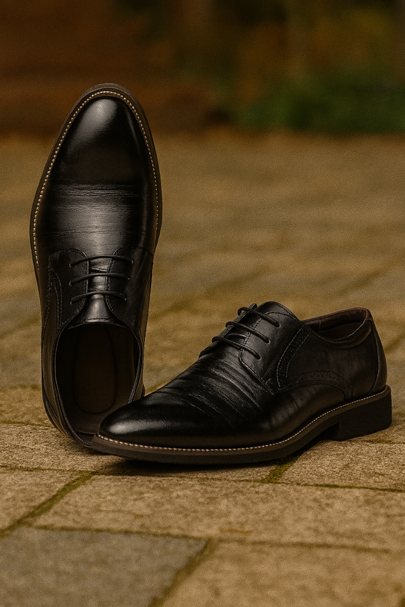 Men's leather Oxford shoes close-up detail of upper stitching and lace-up closure