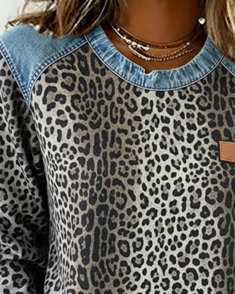 Leopard print top with contrasting denim panel construction and straight silhouette
