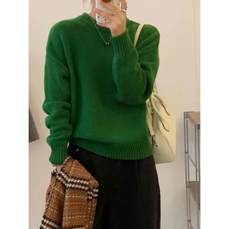 Women's knitted sweater showing neckline and upper body fit