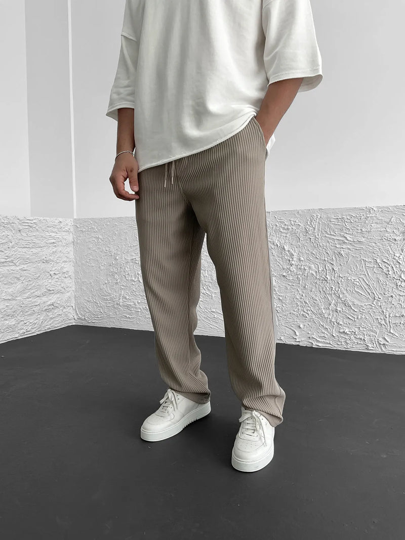 Men's relaxed-fit drawstring trousers with vertical ribbed texture and elastic waistband