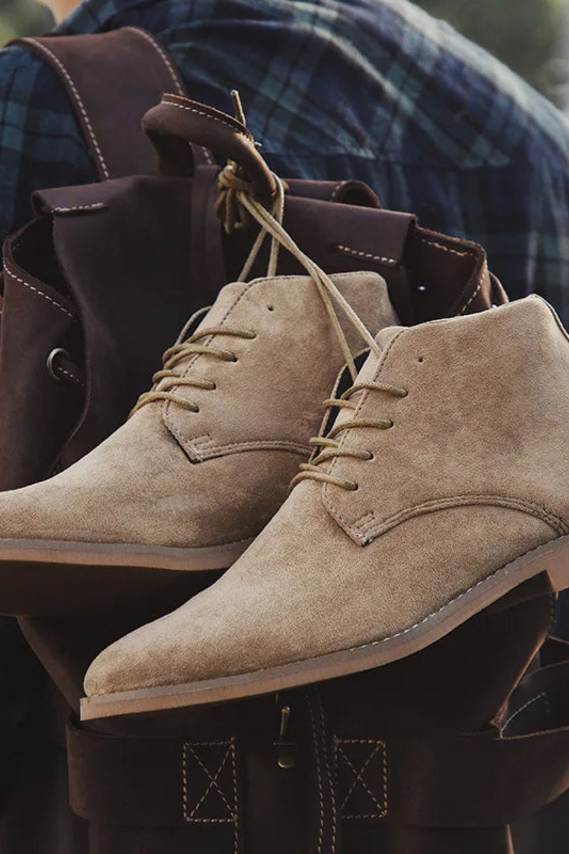 Men's suede desert boots — close-up of lace-up closure and suede upper detail