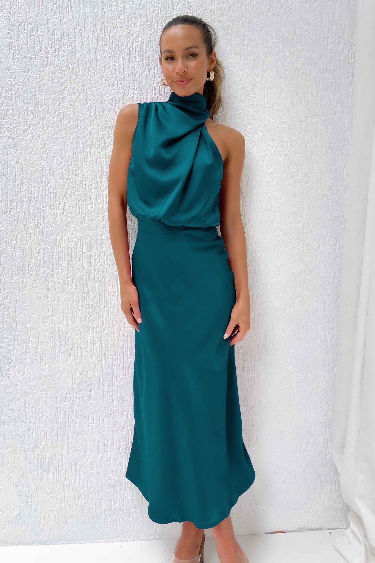 Women's sleeveless satin halterneck midi dress with an even drape and pull-on midi-length style