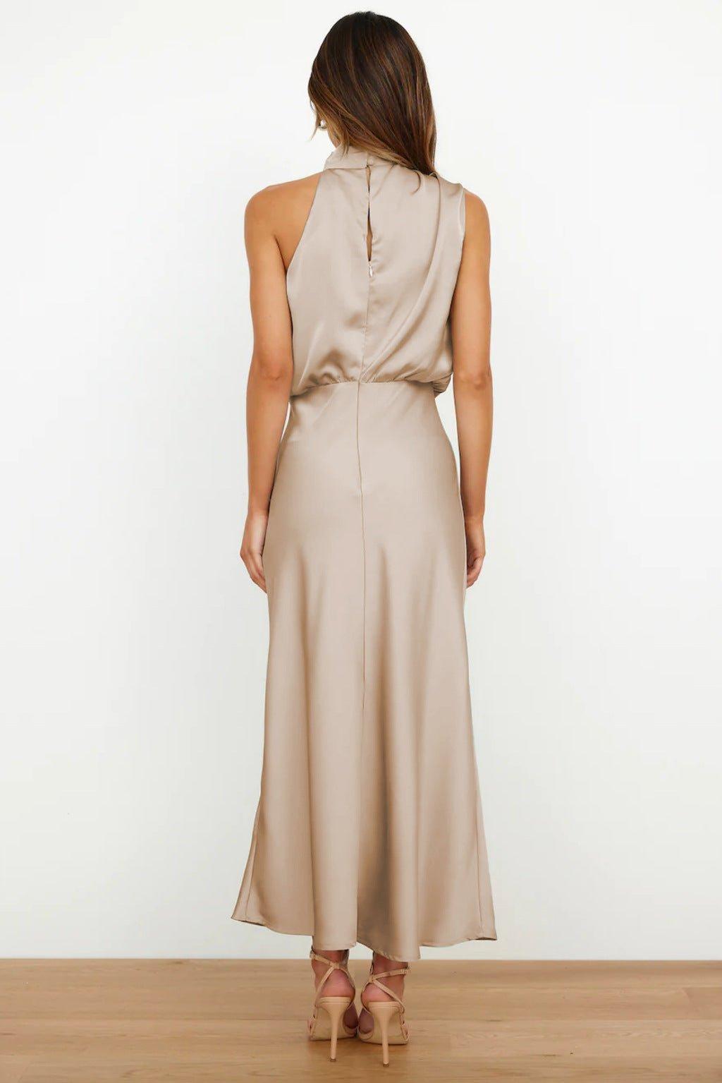 Women's sleeveless halterneck midi dress made from smooth satin fabric with an even surface