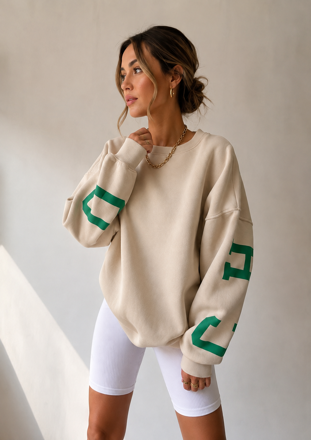Women's sand oversized varsity sweater front view