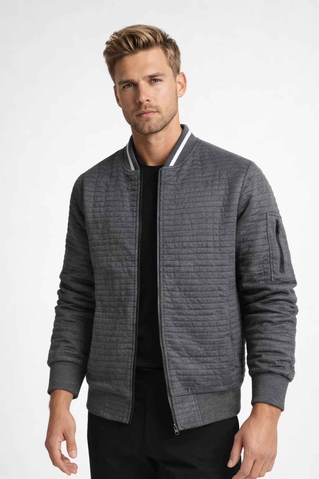 Men's hip-length quilted bomber jacket with structured quilted surface and ribbed finishes