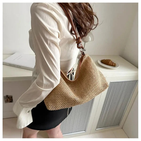 Woman wearing khaki braided shoulder bag