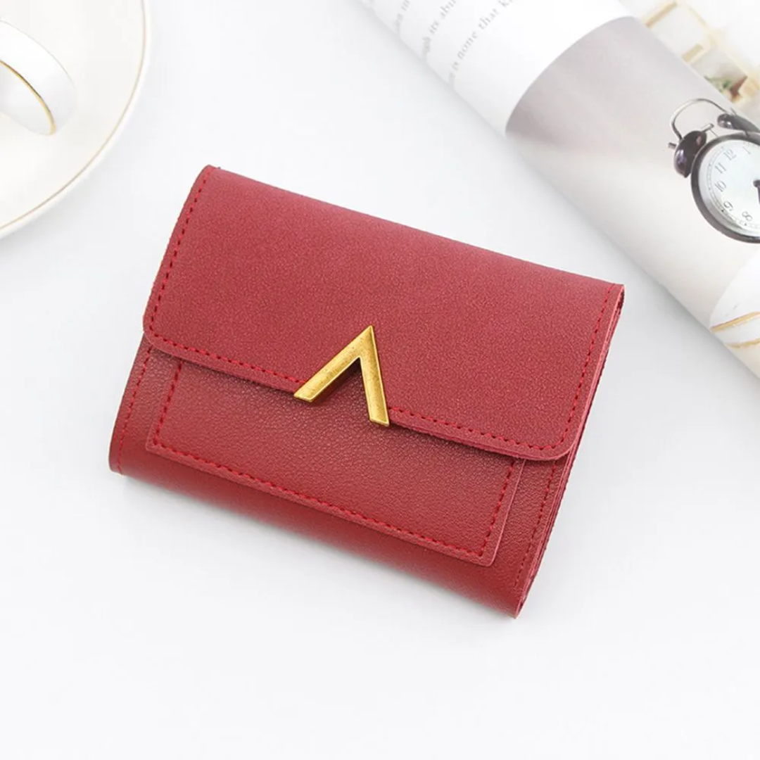 Women's small faux leather wallet with card slots and foldable closure